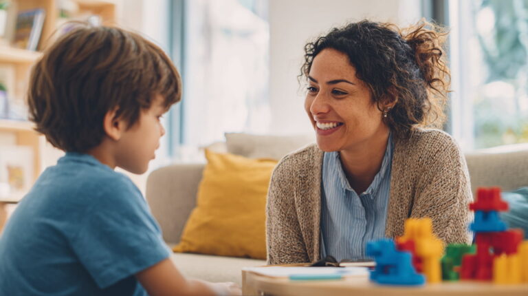 compassionate latino therapist with autism child